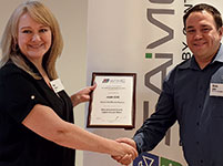 Ann de Beer (left) awards Alvin Seitz (right) the SAIMC presentation certificate.